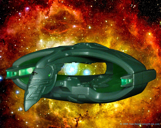 Star Trek: A Romulan Warbird by the Rosette nebula.